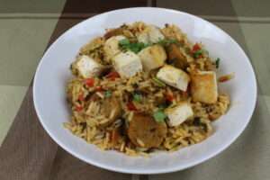 Vegan jambalaya with rice, tofu, and vegetables